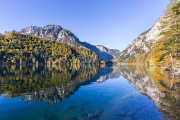 Fototapeta na wymiar Idyllic mountain lake Leopoldsteinersee surrounded by mountains in Austria