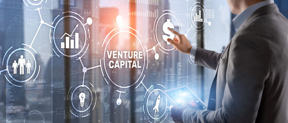 Fototapeta na wymiar Venture capital. Investor capital. Businessman pressing virtual screen inscription