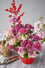 Finished flower arrangement in a vase for home. Flowers bunch, set for interior. Fresh cut flowers for decoration home. European floral shop. Delivery fresh cut flower.