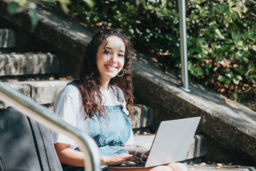 Side-shot enthusiastic happy carefree female student prepare project working laptop sitting outside...
