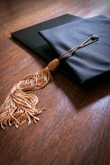 Mortarboard graduation cap and tassle and diploma