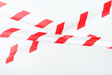 A tape with red and white stripes for the barrier prohibits passage