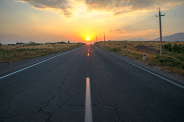 asphalt road at the sunset