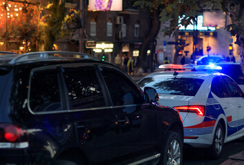 police car in night light city