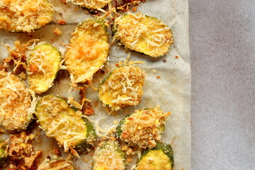 zucchini chips in the oven baked close-up selective focus.
