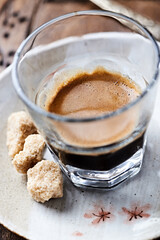 Coffee in glass cup. Close up.