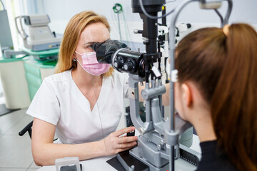Fototapeta na wymiar Eye treatment in clinic or hospital with doctor covid time