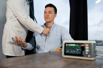The heart rate is measured by a cardiogram at the doctor's office. Visit to the medical office....