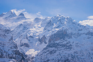 Fototapeta premium Beautiful panoramic view of snow-capped mountains in the Swiss Alps.