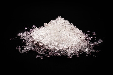 Obraz na płótnie Canvas Sodium Thiosulfate on isolated black background. Solid and crystalline chemical product used in the pharmaceutical industry and in the analysis of drinking water