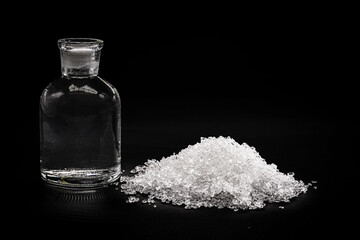 Sodium Thiosulfate on isolated black background. Solid and crystalline chemical product used in the pharmaceutical industry and in the analysis of drinking water