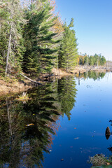 Calm lake water near Copper Harbor Michigan, during fall, with a beautiful reflection