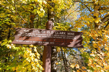 Informational sign for the old Clark Mine near Copper Harbor Michigan during fall