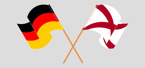 Crossed and waving flags of Germany and The State of Alabama