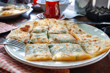 Turkish food. Traditional Turkish pie on a table in a cafe in Istanbul. National Turkish food. Selective focus.