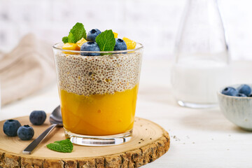 Healthy breakfast chia seeds pudding with mango puree