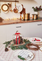 Christmas kitchen and table. Red, green and white decor christmas tree background. New Year celebration. Merry Christmas and Happy New Year.