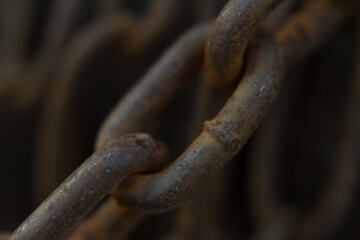 close up part of an old rusted steel chain
