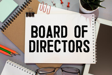 Torn paper with text BOARD OF DIRECTORS, business concept.