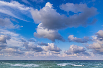 Blue sky with white clouds over sea in Shabla town on Black Sea coast in Bulgaria - obrazy, fototapety, plakaty
