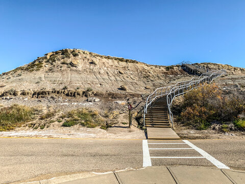 Stairs over a sand and rock formation at the Royal Terrell Museum in Alberta, Canada