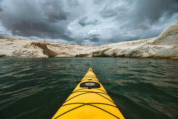 Kayaking in the spring on Lake Powell when the water level is low near Page, Arizona near the Utah...