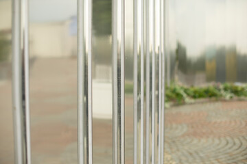 Mirror wall in the park. Architectural element to decorate the city. Reflective surface.