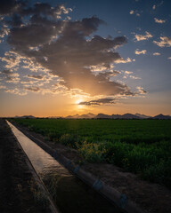 Agriculture water canal next to farmland in Tucson, Arizona. 
