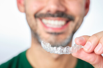 man with transparent dental retainer - obrazy, fototapety, plakaty