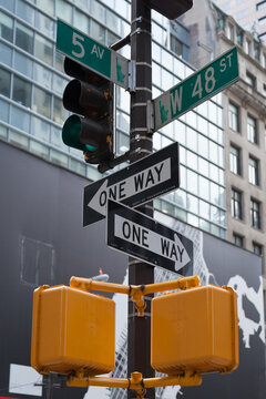 Street signs at the corner of West 48th Street and 5th Avenue in Manhattan