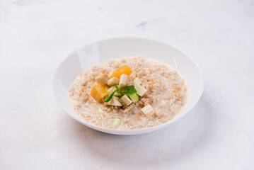 bowl of oatmeal with fruits