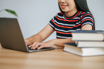 A young woman working with a laptop