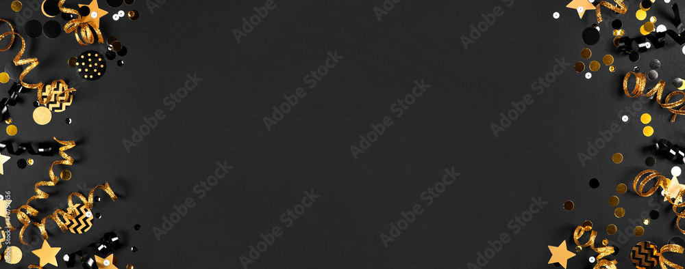Poster new years party double border of shiny black and gold streamers and confetti. overhead down view on 