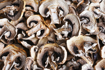 A top view image of dehydrated organic sliced mushrooms ready for storage. 
