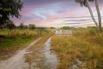 fire road with road closed signs after rain