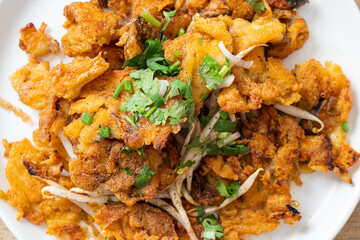 Crispy fried mussel pancake with egg
