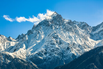 Fototapeta na wymiar Snow peak of Kinnaur Kailash Himalaya range as viewed from Kalpa Himachal Pradesh, India