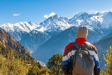 Tourist backpacker enjoy view of the Kailash Himalaya mountain range at Kalpa Himachal Pradesh,...