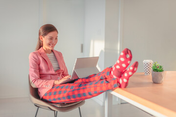 Working from home Asian woman streaming videoconference online in pajamas with suit blazer for remote work. Funny pandemic lifestyle concept - 470763805