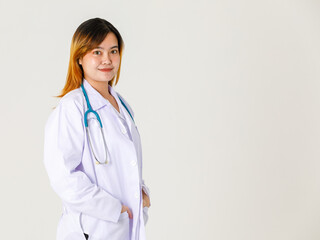 Portrait studio shot of Asian young successful professional confident dyed hair female doctor in lab coat hanging stethoscope around neck look at camera on white background