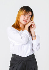 Portrait studio shot of Asian young confident female designer entrepreneur model in casual fashionable wears standing posing look at camera holding hand touch face crossed arm on white background