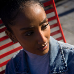 Portrait of a young woman in a blue denim jacket