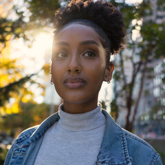 Portrait of a young woman in a blue denim jacket