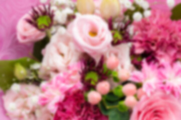 プレゼントやイベントの背景に使えるピンクの花束のボケ（ぼかし）素材