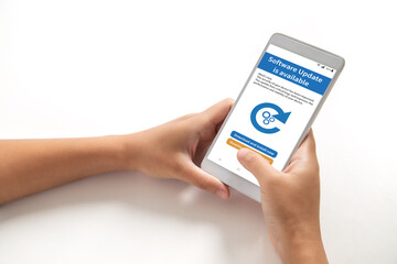 Software update in available, Hand holding smart phone with software update on screen. Program upgrade, Business, Technology, Internet, Electronic Device Display.