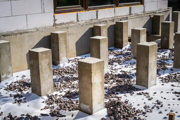 Concrete pillars poured for the construction of the terrace frame