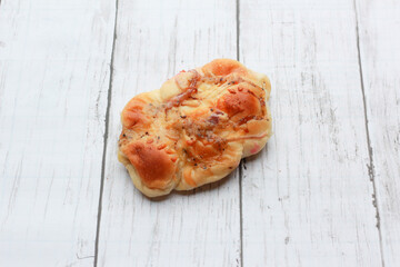 Bread is a staple food prepared from a dough of flour and water, usually by baking.
