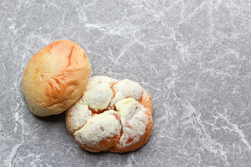 Bread is a staple food prepared from a dough of flour and water, usually by baking.