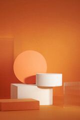 Front view of white and orange podium with and flower in a orange background for advertising ,...