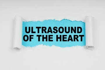 In the middle of a white sheet in space on a blue background the inscription - ultrasound of the heart